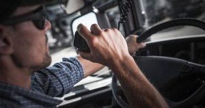 Truck Driver Talking On A CB Radio Truck Driver Talking On A CB Radio